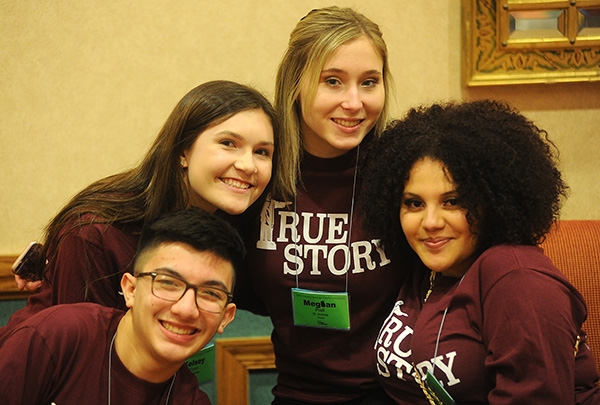 St. Andrew Parish of Sloan parishioners Jakob Carney, 15, Kelsey Flynn, 17, Megan Prell, 17 and Paige Crawford, 17, are all smiles during 